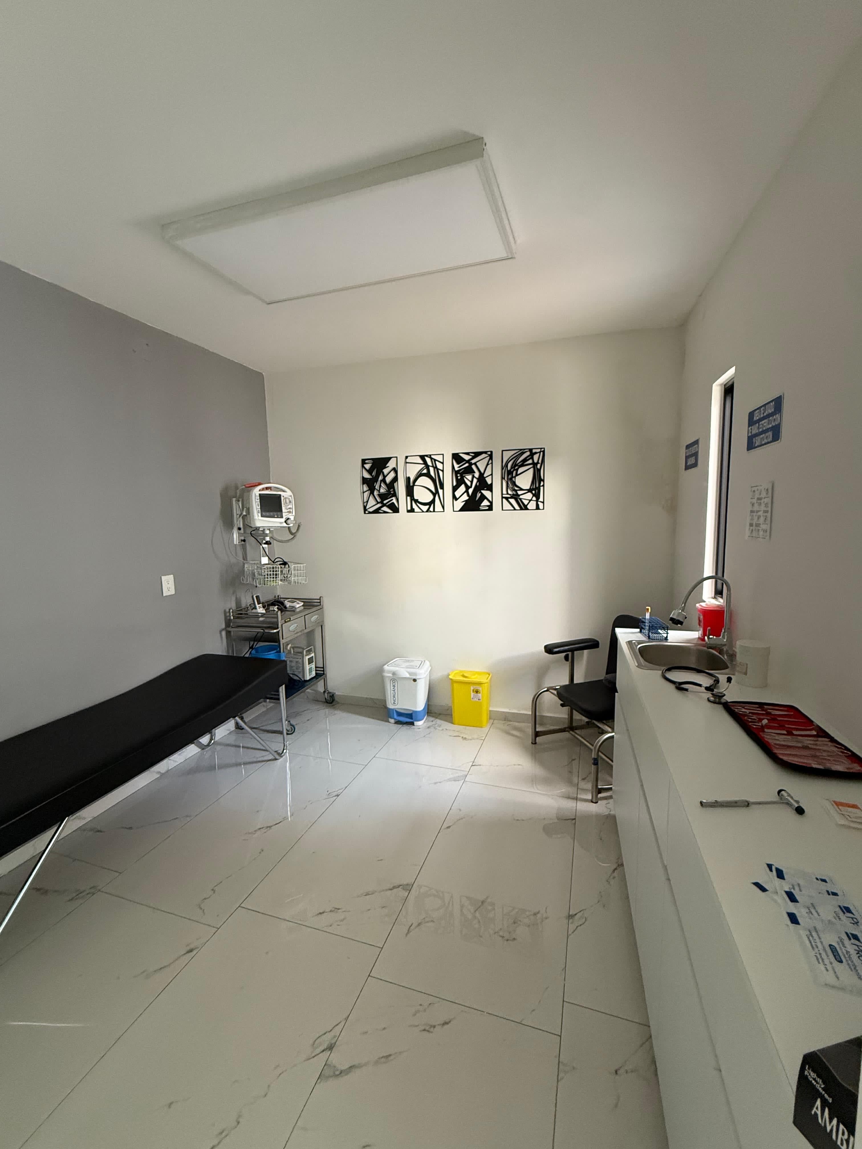 A nurse specialized in wound care treating a patient's leg.