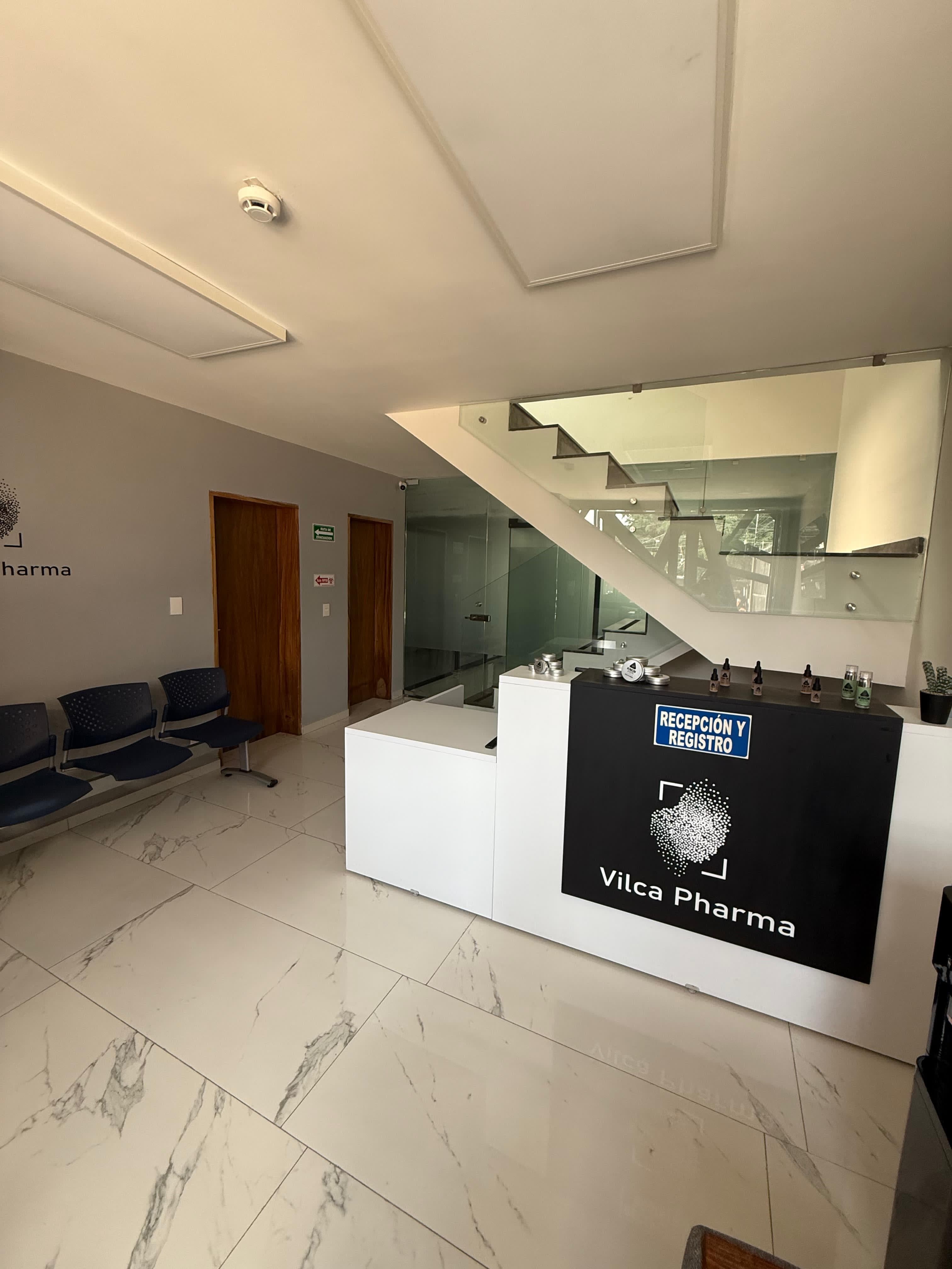 A friendly receptionist at a medical clinic front desk.